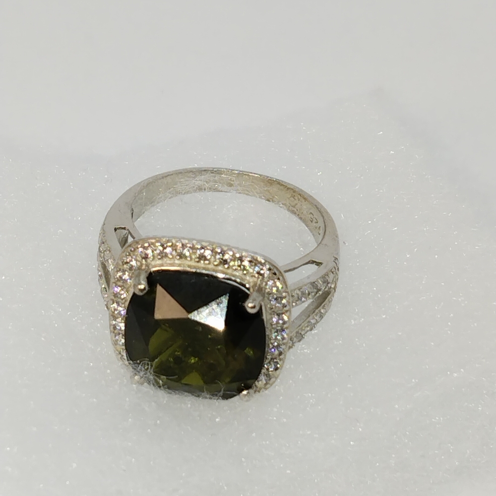 Elegant Silver and Green Gemstone Ring with Diamond Halo